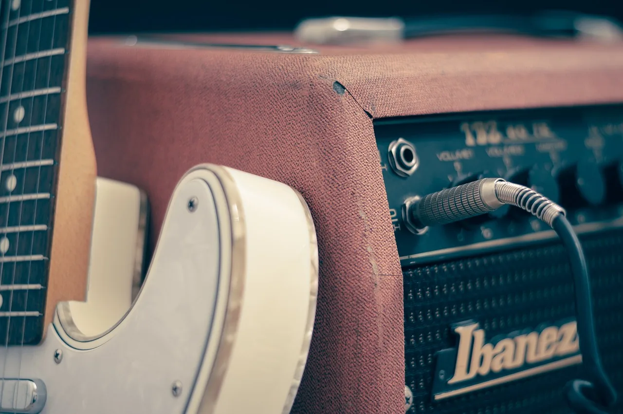 Electric guitar connected to an amplifier Electric guitar connected to an amplifier
