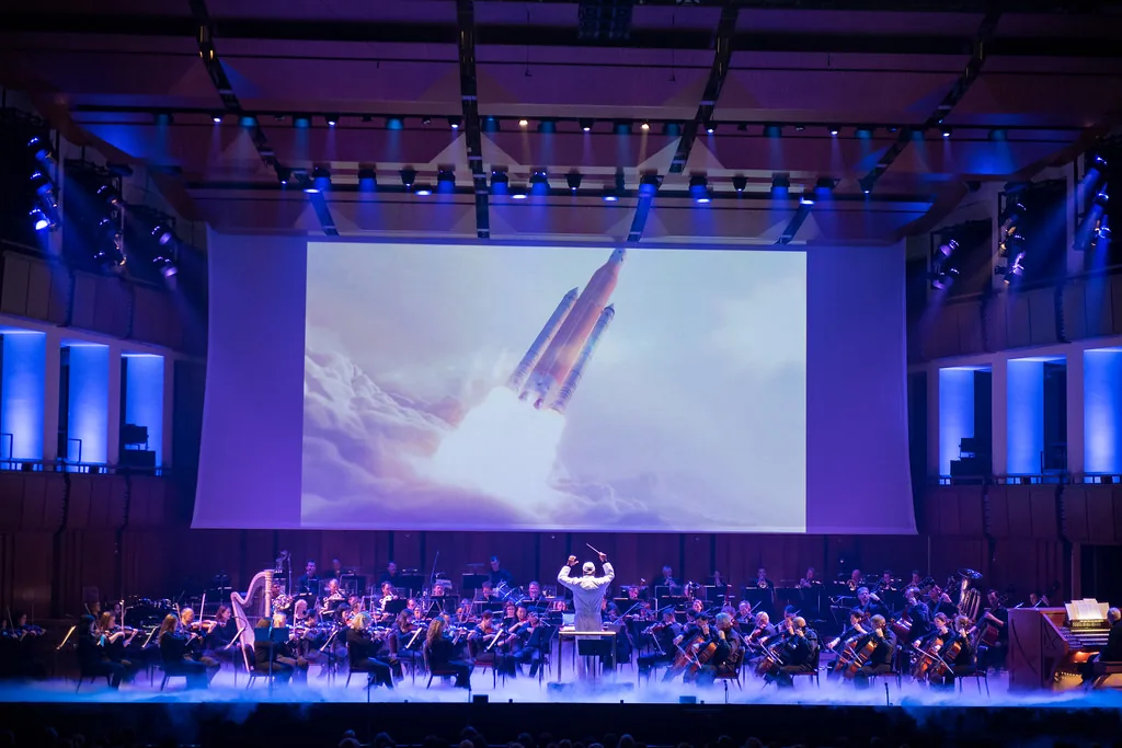 Symphony orchestra at a multimedia concert Symphony orchestra at a multimedia concert