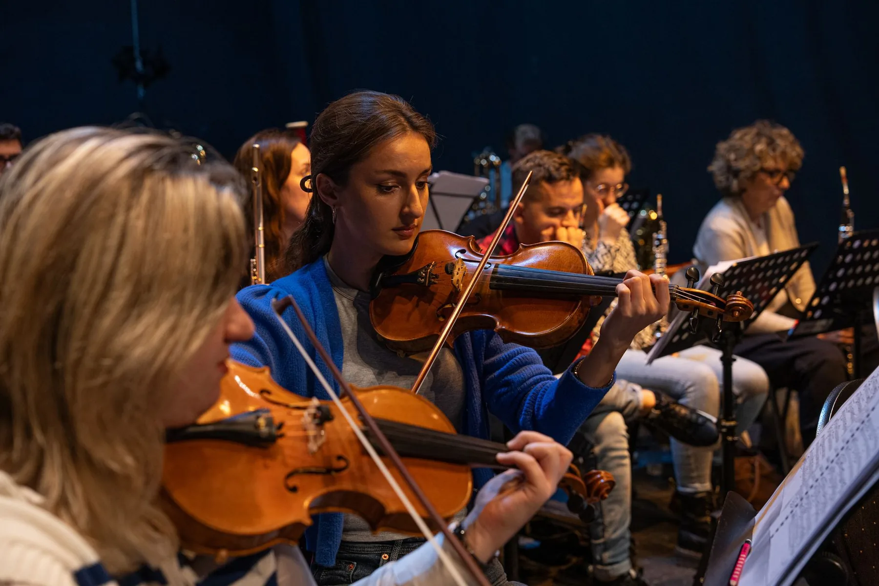Violinists at an orchestral rehearsal Violinists at an orchestral rehearsal