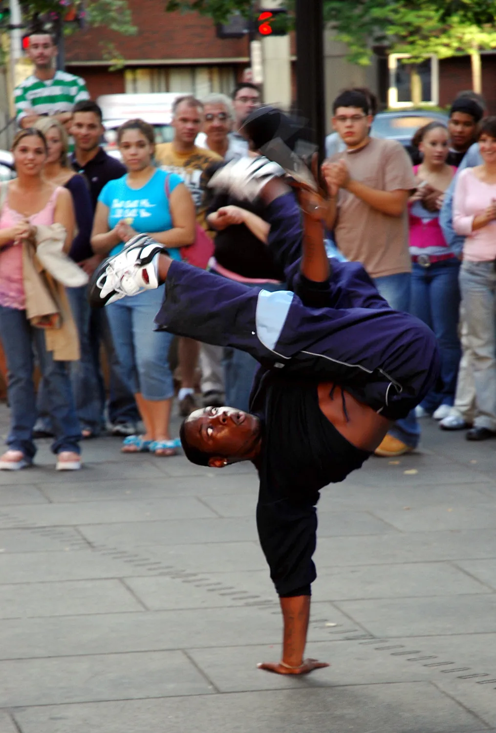 Hip-hop breakdancer performing a move Hip-hop breakdancer performing a move