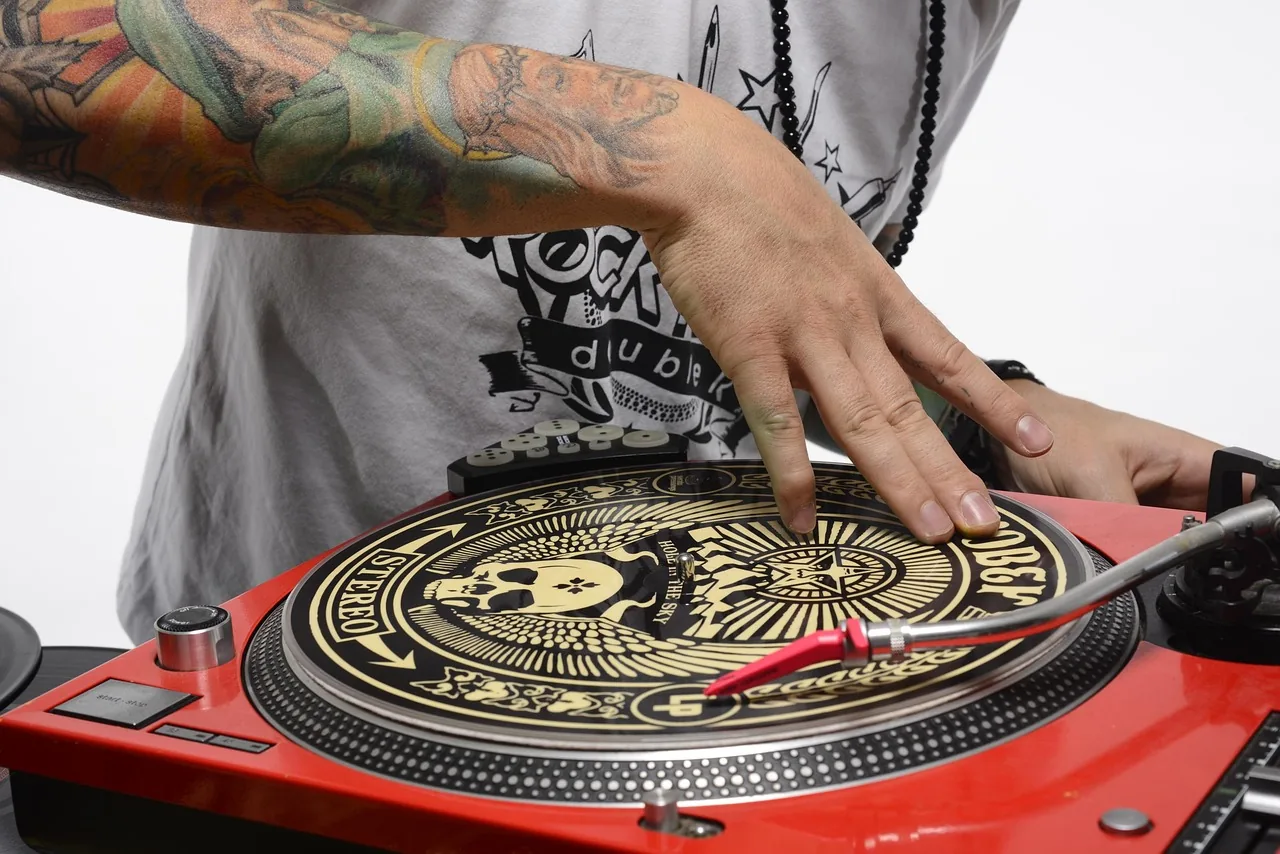 Hip-hop DJ at vinyl turntables Hip-hop DJ at vinyl turntables