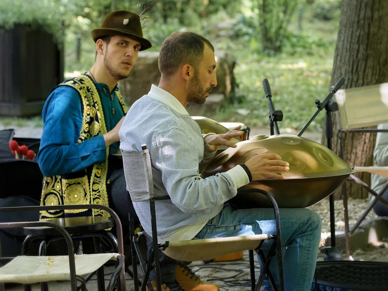 Musician playing a tongue drum Musician playing a tongue drum