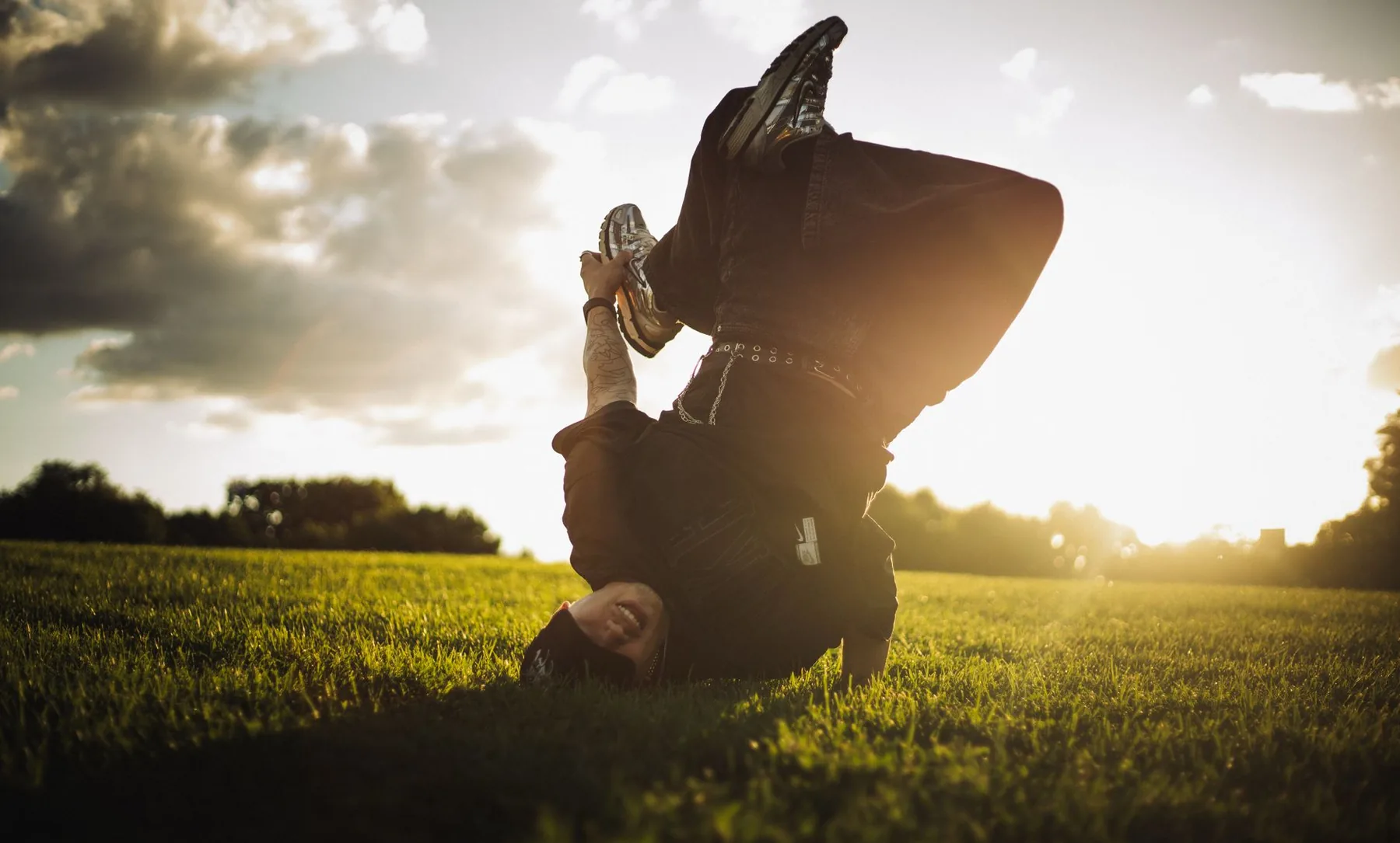 Hip-hop breakdancer in a field