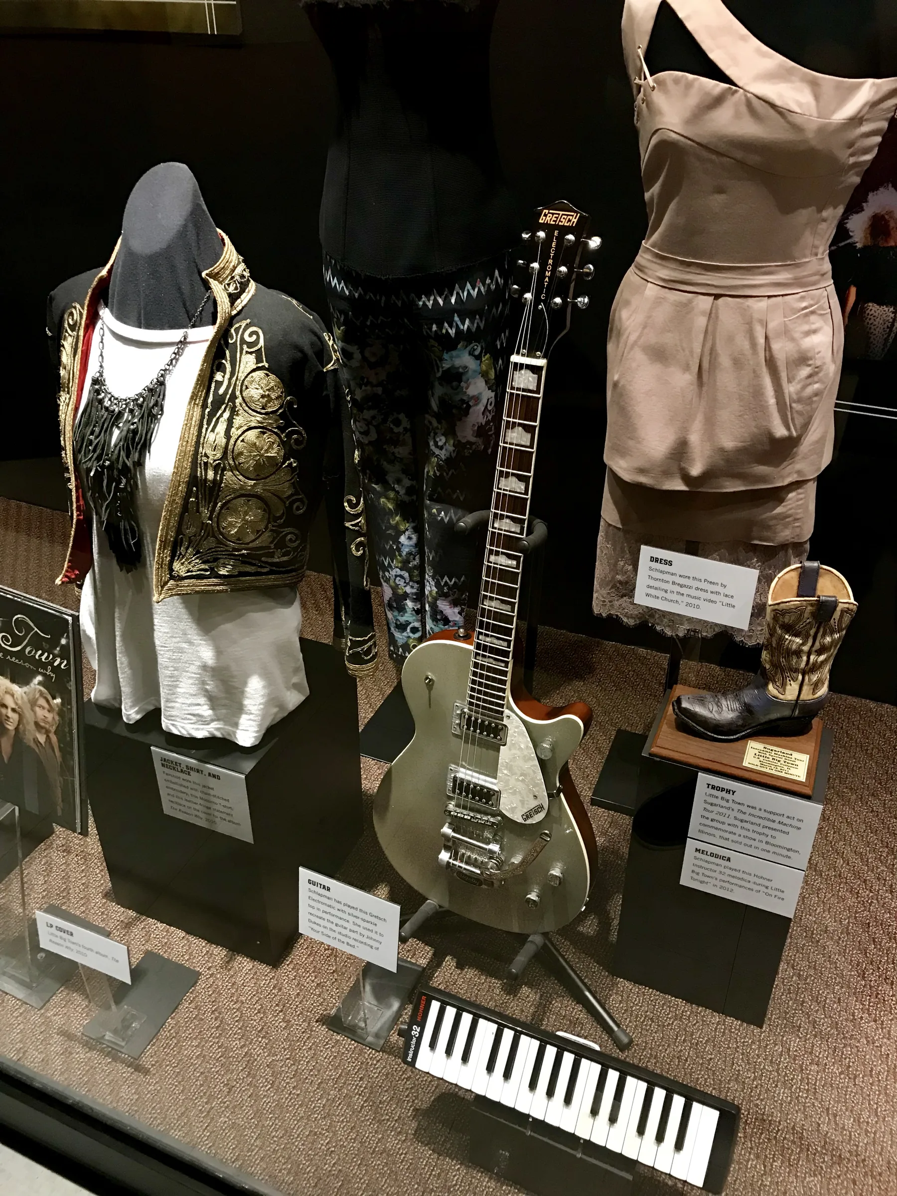 Melodica and guitar displayed in a museum Melodica and guitar displayed in a museum