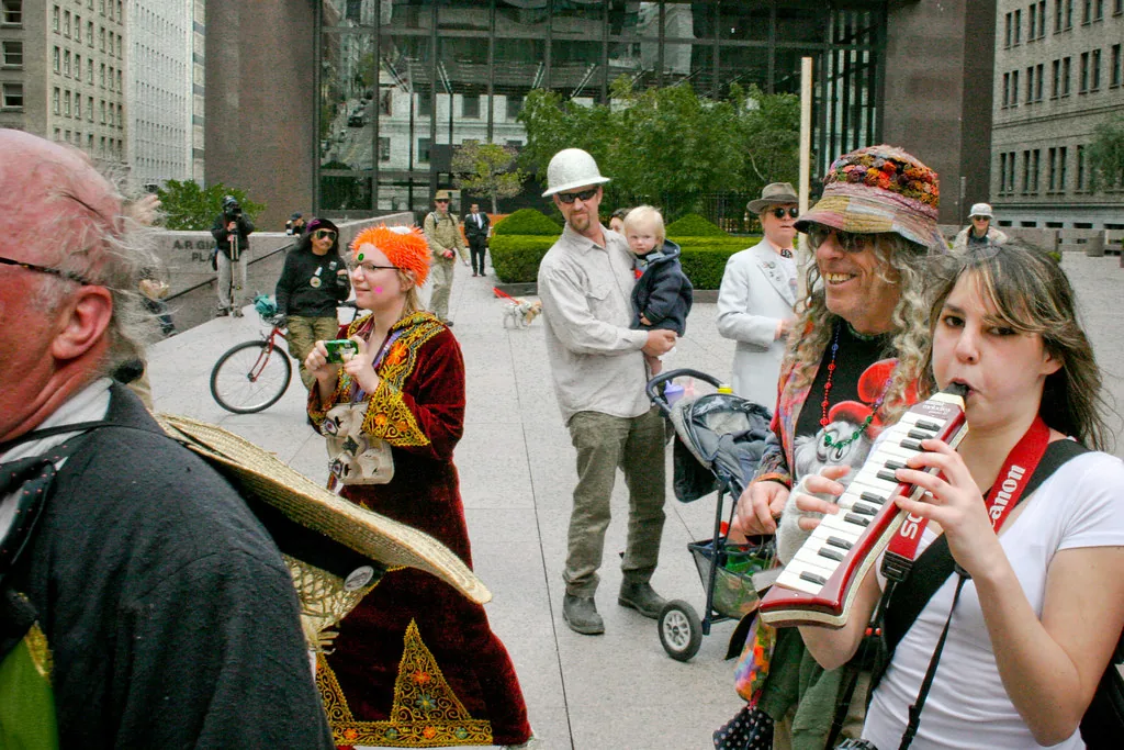 Female musician playing a melodica outdoors