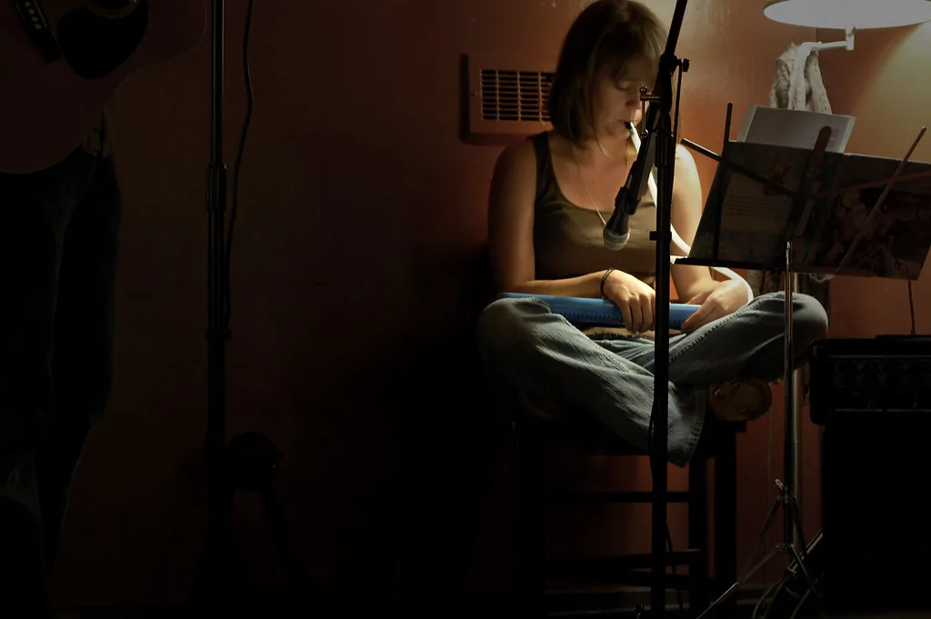 Musician playing the melodica with sheet music Musician playing the melodica with sheet music